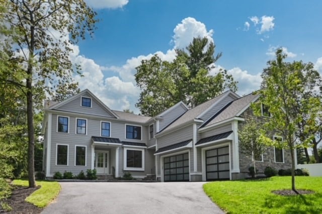 view of front facade with a front lawn and a garage