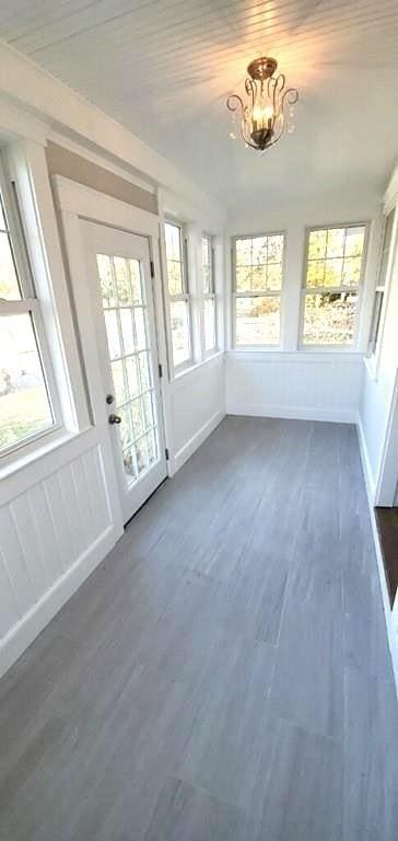 60 Grove St, Barnstable, MA 02601 - unfurnished sunroom with healthy amount of natural light and a chandelier