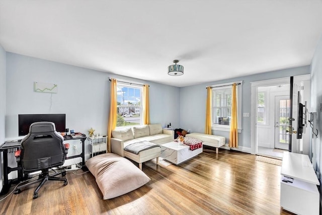 60 Grove St, Barnstable, MA 02601 - living room with healthy amount of natural light, wood finished floors, and a desk
