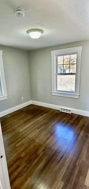 60 Grove St, Barnstable, MA 02601 - empty room featuring baseboards, dark wood finished floors, and a smoke detector