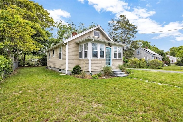 60 Grove St, Barnstable, MA 02601 - view of home's exterior featuring a chimney
