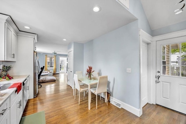 60 Grove St, Barnstable, MA 02601 - dining room featuring light wood-style floors, recessed lighting, baseboards, and vaulted ceiling