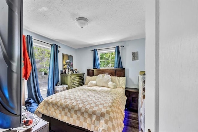 60 Grove St, Barnstable, MA 02601 - bedroom featuring wood finished floors and a textured ceiling