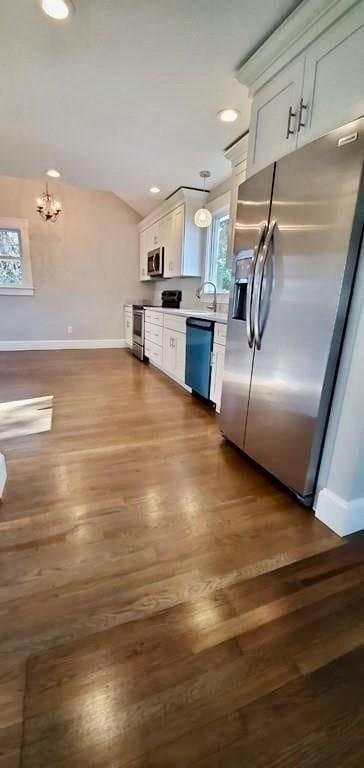 60 Grove St, Barnstable, MA 02601 - kitchen with appliances with stainless steel finishes, white cabinetry, baseboards, dark wood-style flooring, and recessed lighting