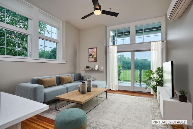 58 Main St Unit 4, Hatfield, MA 01038 - living room with a wall mounted air conditioner, wood finished floors, and ceiling fan