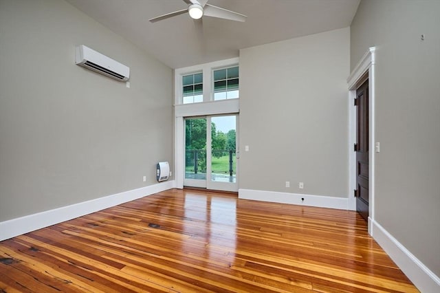 58 Main St Unit 4, Hatfield, MA 01038 - empty room featuring an AC wall unit, a ceiling fan, and hardwood / wood-style floors