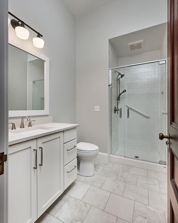 58 Main St Unit 4, Hatfield, MA 01038 - bathroom featuring vanity, a shower stall, and marble finish floors