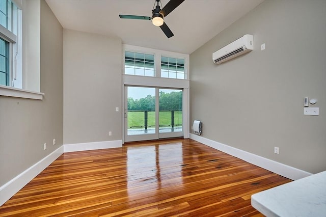 58 Main St Unit 4, Hatfield, MA 01038 - unfurnished room featuring a wall unit AC, wood finished floors, and ceiling fan