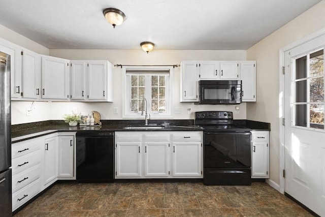 kitchen with sink, a wealth of natural light, white cabinets, and black appliances