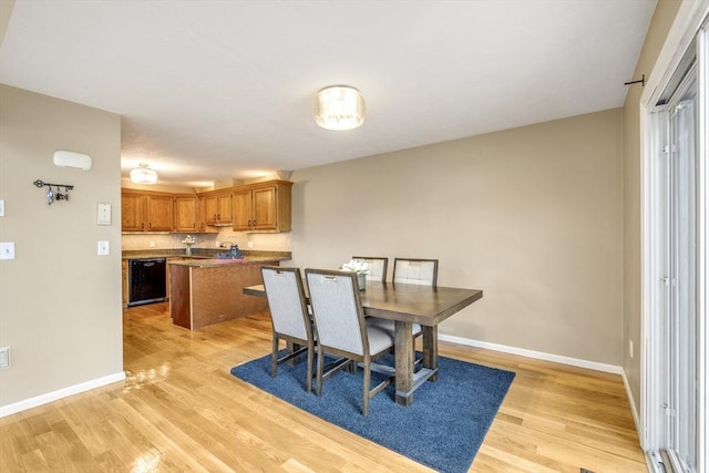 dining room with light wood-type flooring