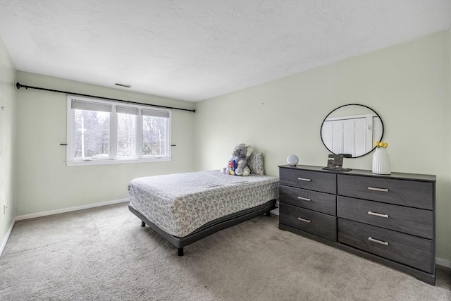 bedroom with light colored carpet