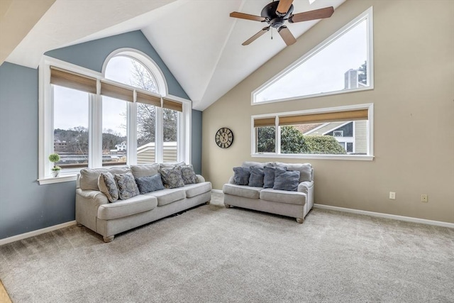 carpeted living room featuring ceiling fan and high vaulted ceiling