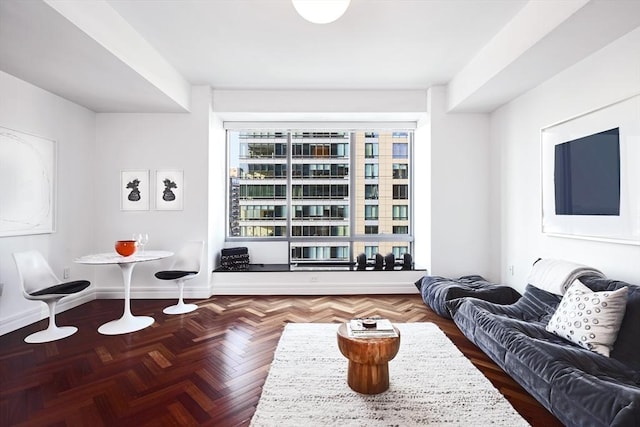 living room featuring dark parquet floors