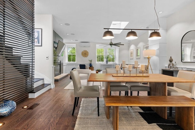 dining area featuring wood finished floors, stairway, a wall mounted air conditioner, and ceiling fan
