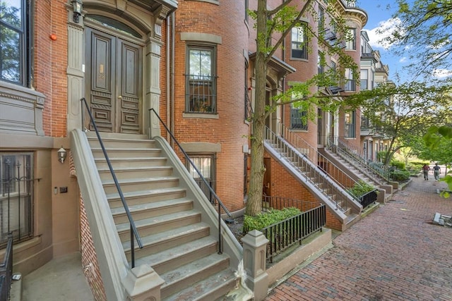 property entrance with brick siding
