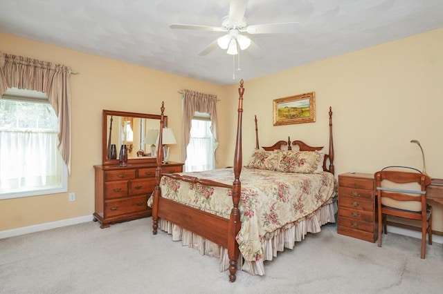 carpeted bedroom with baseboards and ceiling fan
