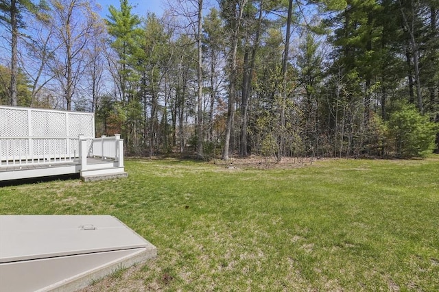 view of yard with a wooden deck