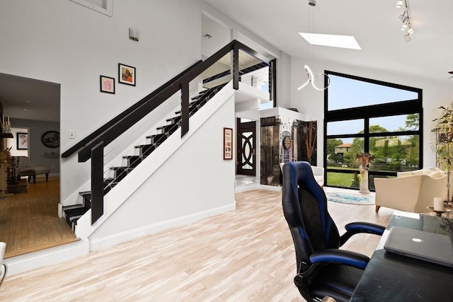 75 Narrows Rd, Freetown, MA 02702 - office featuring a high ceiling, wood finished floors, a skylight, and baseboards