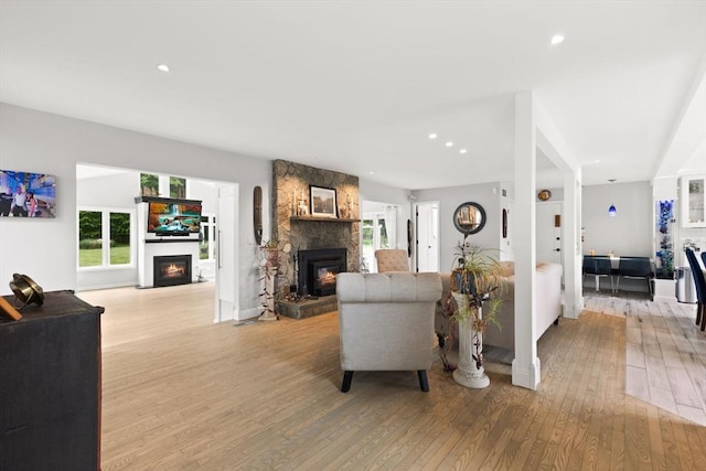 75 Narrows Rd, Freetown, MA 02702 - living area featuring a fireplace, light wood finished floors, plenty of natural light, and recessed lighting