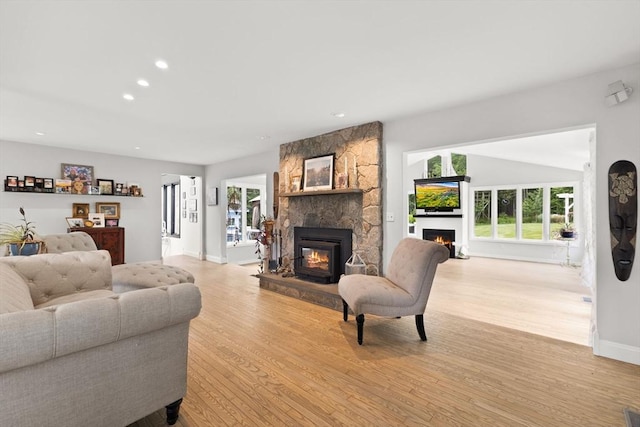 75 Narrows Rd, Freetown, MA 02702 - living area with a stone fireplace, light wood-type flooring, plenty of natural light, and recessed lighting
