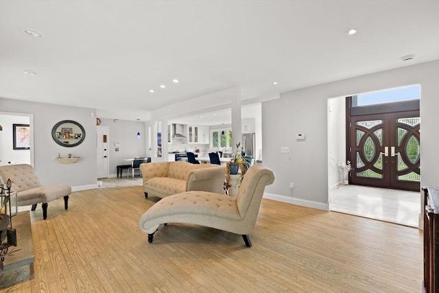 75 Narrows Rd, Freetown, MA 02702 - living area with light wood-style flooring, baseboards, plenty of natural light, recessed lighting, and french doors