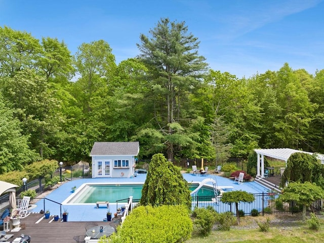 75 Narrows Rd, Freetown, MA 02702 - view of pool with a water slide, a view of trees, and a deck