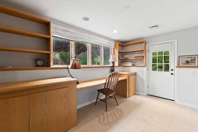 75 Narrows Rd, Freetown, MA 02702 - home office with built in desk, baseboards, and light tile patterned floors