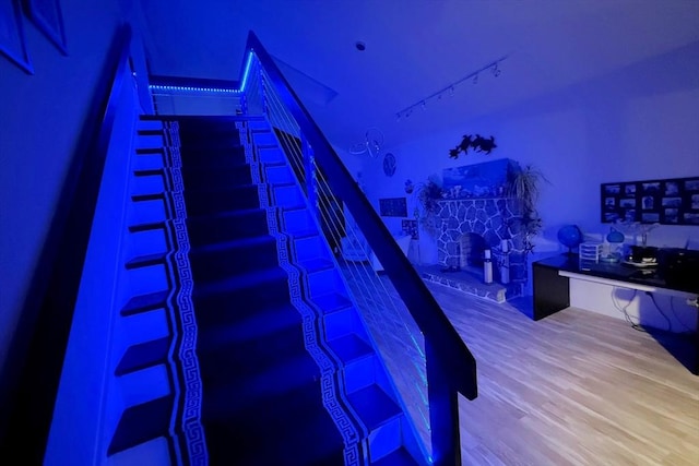 75 Narrows Rd, Freetown, MA 02702 - stairway featuring a fireplace and wood finished floors