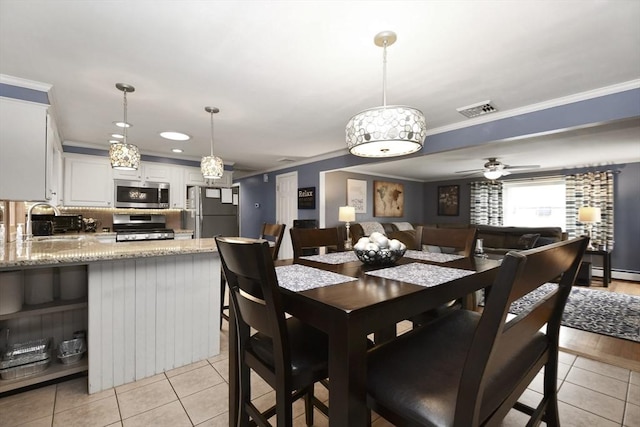 dining area with ceiling fan, visible vents, ornamental molding, and light tile patterned flooring