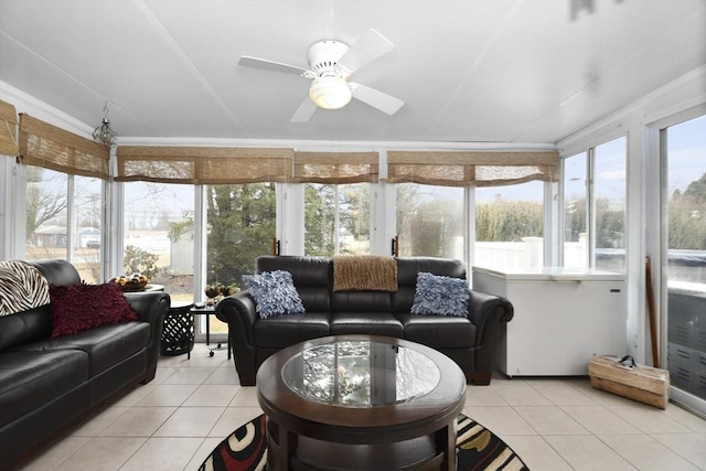 sunroom featuring plenty of natural light and a ceiling fan