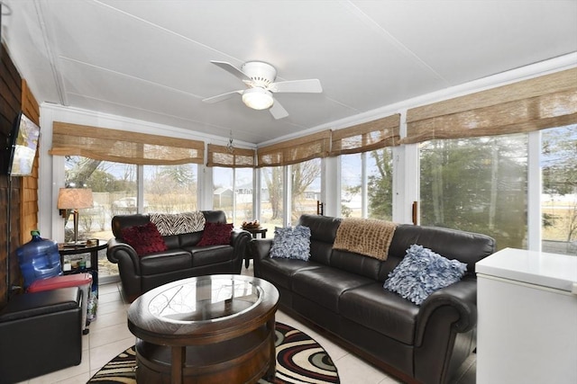 sunroom with a ceiling fan and a healthy amount of sunlight