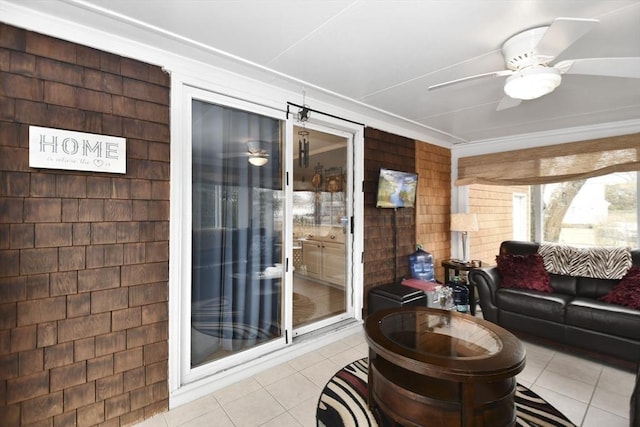 tiled living room with a ceiling fan