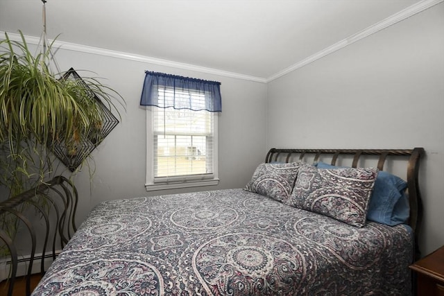 bedroom with a baseboard heating unit and ornamental molding