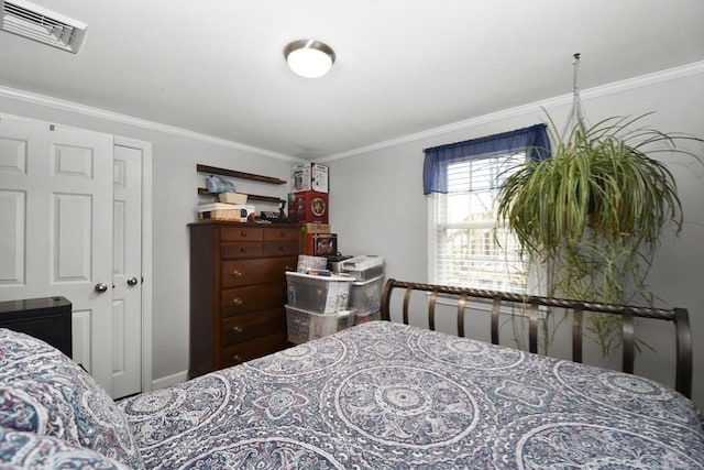 bedroom with ornamental molding and visible vents