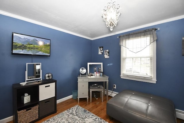 home office featuring a chandelier, a baseboard heating unit, baseboards, and wood finished floors