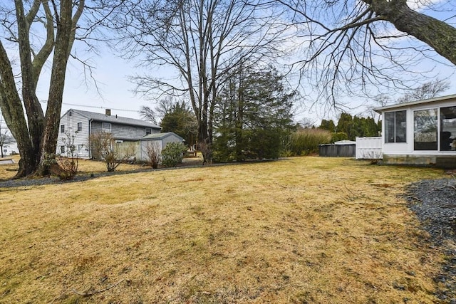 view of yard with a sunroom