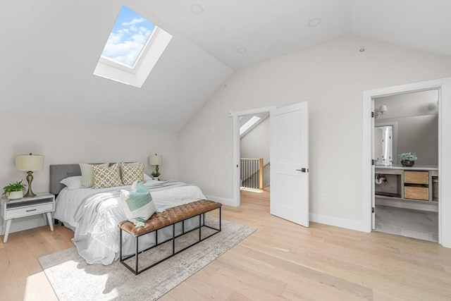130 Cushing St Unit Ph1, Cambridge, MA 02138 - bedroom featuring lofted ceiling, a skylight, and light wood-type flooring