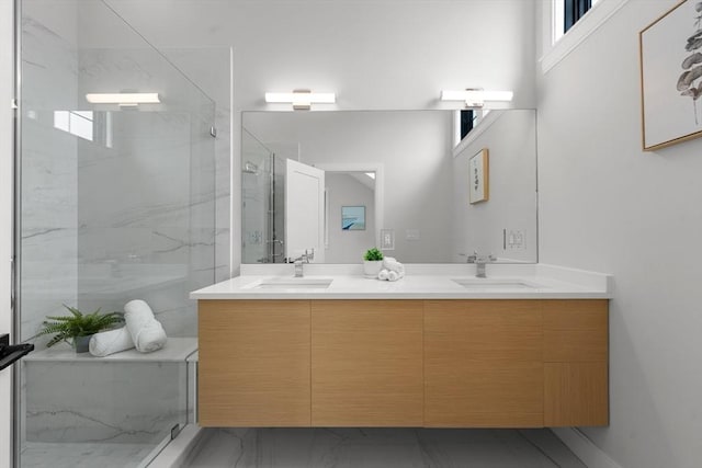 130 Cushing St Unit Ph1, Cambridge, MA 02138 - bathroom featuring double vanity, a marble finish shower, and marble look tile flooring