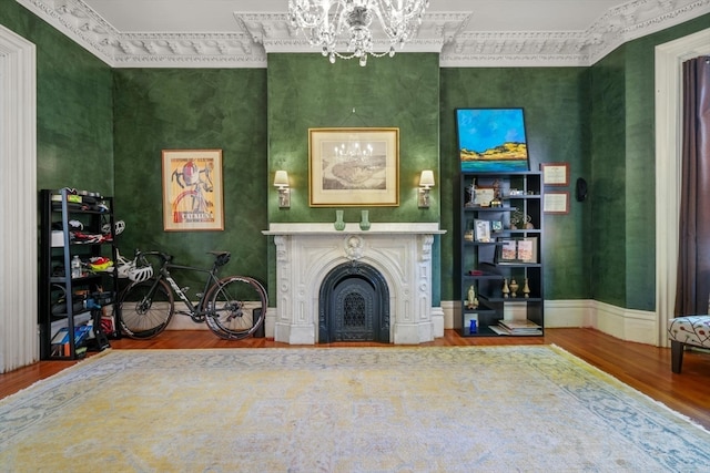 unfurnished living room featuring hardwood / wood-style floors and ornamental molding