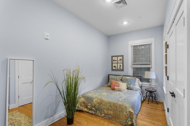 bedroom with light hardwood / wood-style floors