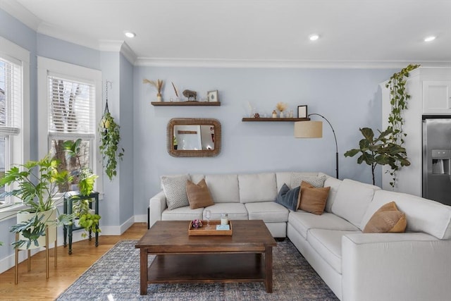 living room with wood-type flooring and ornamental molding