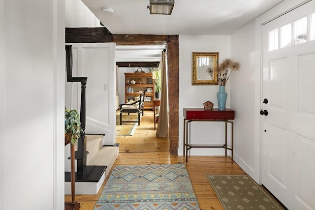 foyer entrance with hardwood / wood-style floors