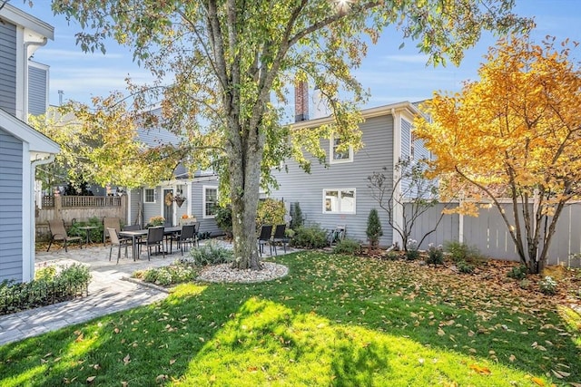 view of yard featuring an outdoor structure and a patio area