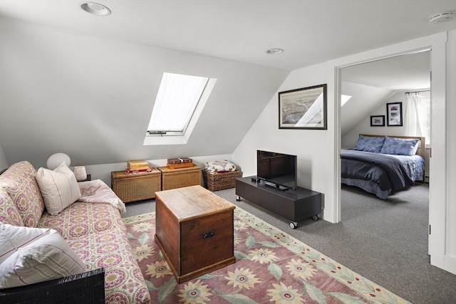 interior space featuring carpet floors and lofted ceiling with skylight