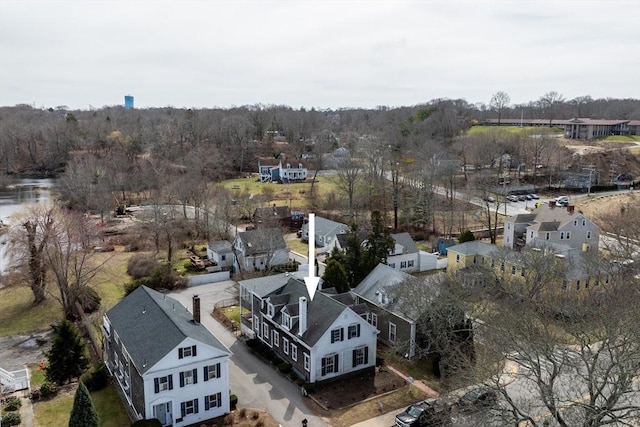 birds eye view of property featuring a residential view and a view of trees