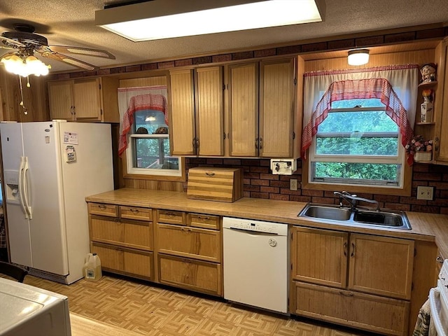 24 Arnold St, Ludlow, MA 01056 - kitchen with white appliances, light countertops, ceiling fan, brown cabinetry, and a textured ceiling
