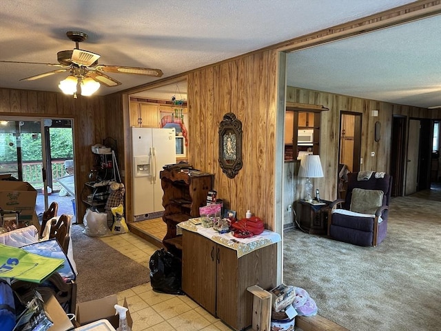 24 Arnold St, Ludlow, MA 01056 - living room with wood walls, a textured ceiling, and a ceiling fan