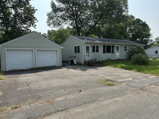 24 Arnold St, Ludlow, MA 01056 - single story home with a detached garage and an outbuilding