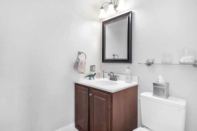 half bath with vanity and toilet