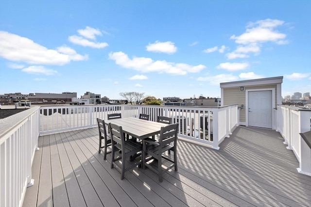 wooden deck featuring outdoor dining space